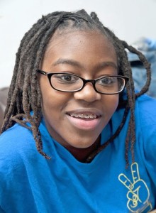 Danielle Cook, 13, an eighth-grader at Afya Public Charter School, is interested in applying to Cristo Rey, but she was told that her dreadlocks go against the high school's policy. Her mother, Dawnetta Jenkins, who takes care of Danielle's hair, also has dreadlocks. After inquiries from The Sun, the school said it was doing away with the policy.