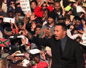 **ADVANCE FOR THURSDAY, FEB. 12** In this Jan. 17, 2000 file photo Kweisi Mfume, president and CEO of the NAACP, waves to the crowd during a rally in Columbia, S.C.  An estimated 46,000 people gathered to demand  the removal of the Confederate flag from the dome of the Statehouse. (AP Photo/Lou Krasky, file)