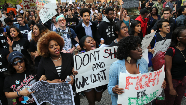 BALTIMORE, MD - APRIL 29: Students from Baltimore colleges and high schools march in protest chanting "Justice for Freddie Gray" on their way to City Hall April 29, 2015 in Baltimore, Maryland. Baltimore remains on edge in the wake of the death of Freddie Gray, though the city has been largely peaceful following a day of rioting this past Monday. Gray, 25, was arrested for possessing a switch blade knife April 12 outside the Gilmor Houses housing project on Baltimore's west side. According to his attorney, Gray died a week later in the hospital from a severe spinal cord injury he received while in police custody. (Photo by Win McNamee/Getty Images)