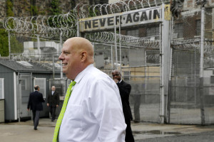 Maryland Gov. Larry Hogan arrives at Baltimore City Detention Center, Thursday, July 30, 2015, in Baltimore, before speaking at a news conference to announce his plan to immediately shut down the jail. The jail grabbed headlines in 2013 after a sweeping federal indictment exposed a sophisticated drug- and cellphone-smuggling ring involving dozens of gang members and correctional officers. (AP Photo/Patrick Semansky)
